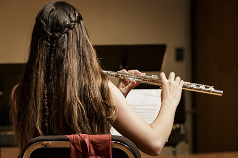 Musician plays the flute in the Stamps Woodwind Quintet